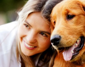 girl laying with dog