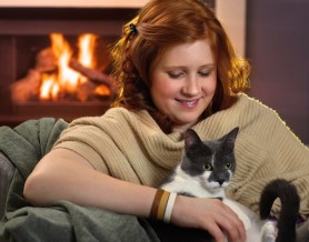 girl holding cat by the fire, pet boarding Melbourne FL